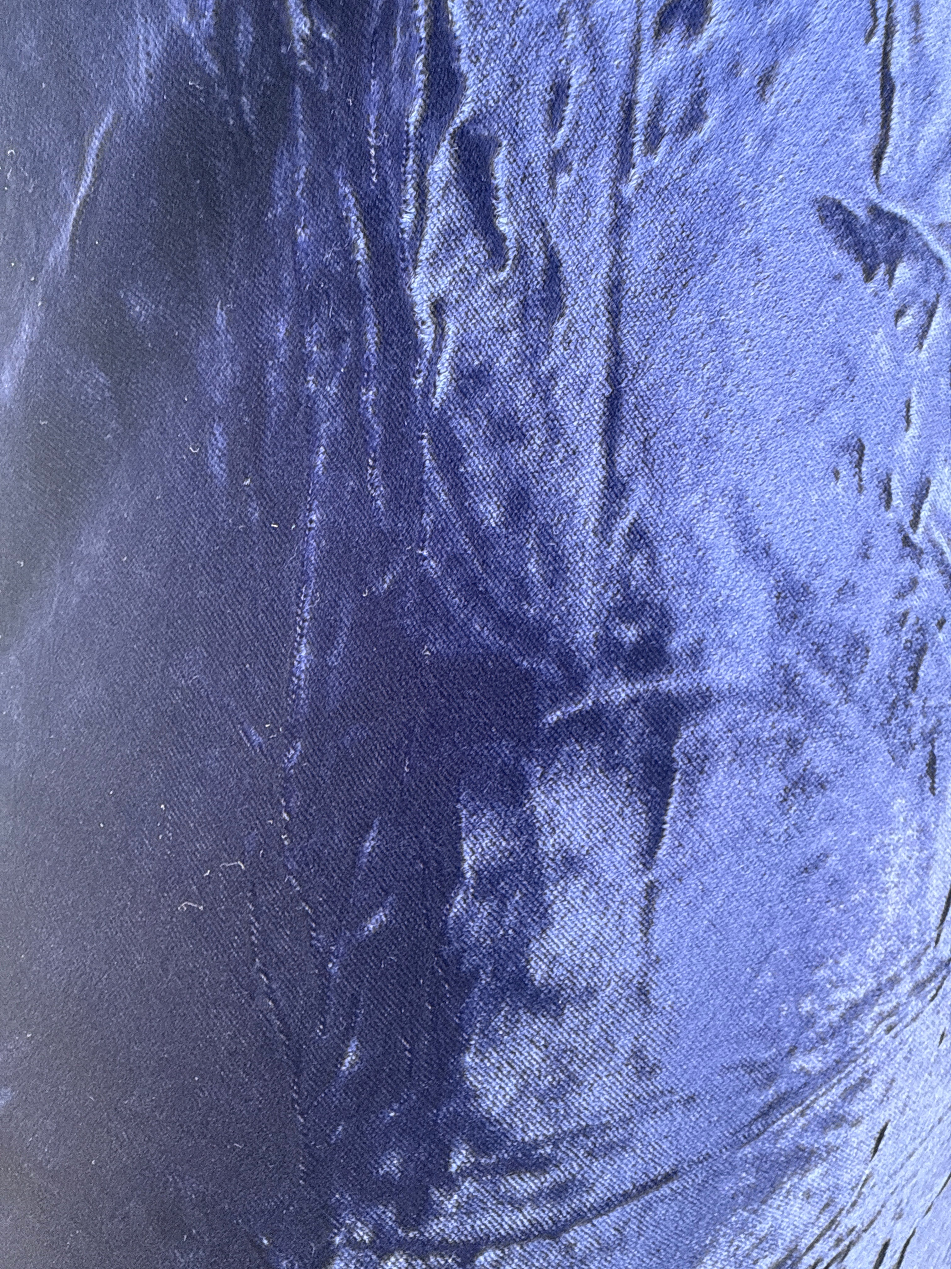 Close-up of blue fabric texture, velvet in the sunlight 