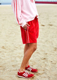 person wearing Hammil and co velour shorts red - Stay Wild Collective  