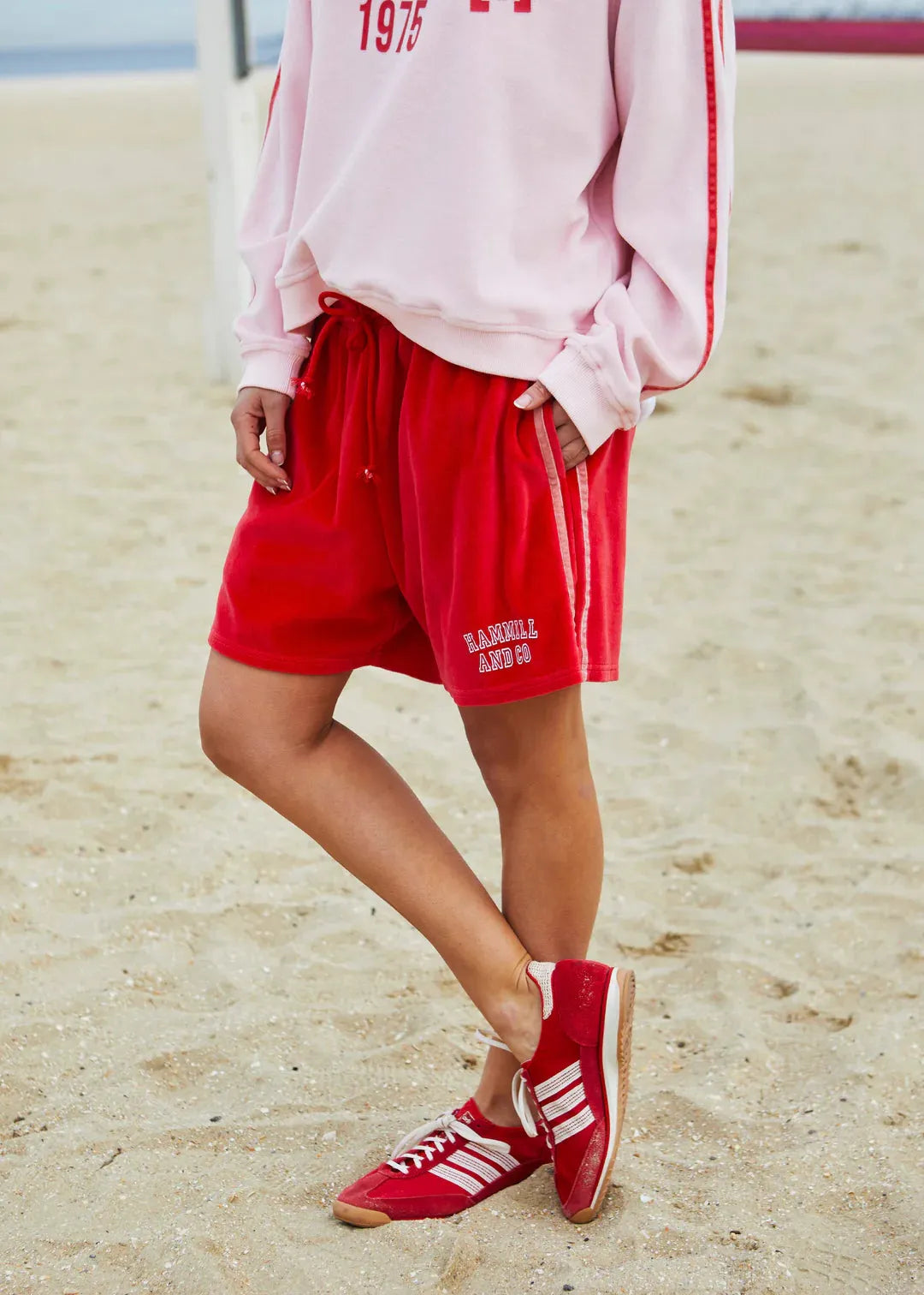 person wearing Hammil and co velour shorts red - Stay Wild Collective  