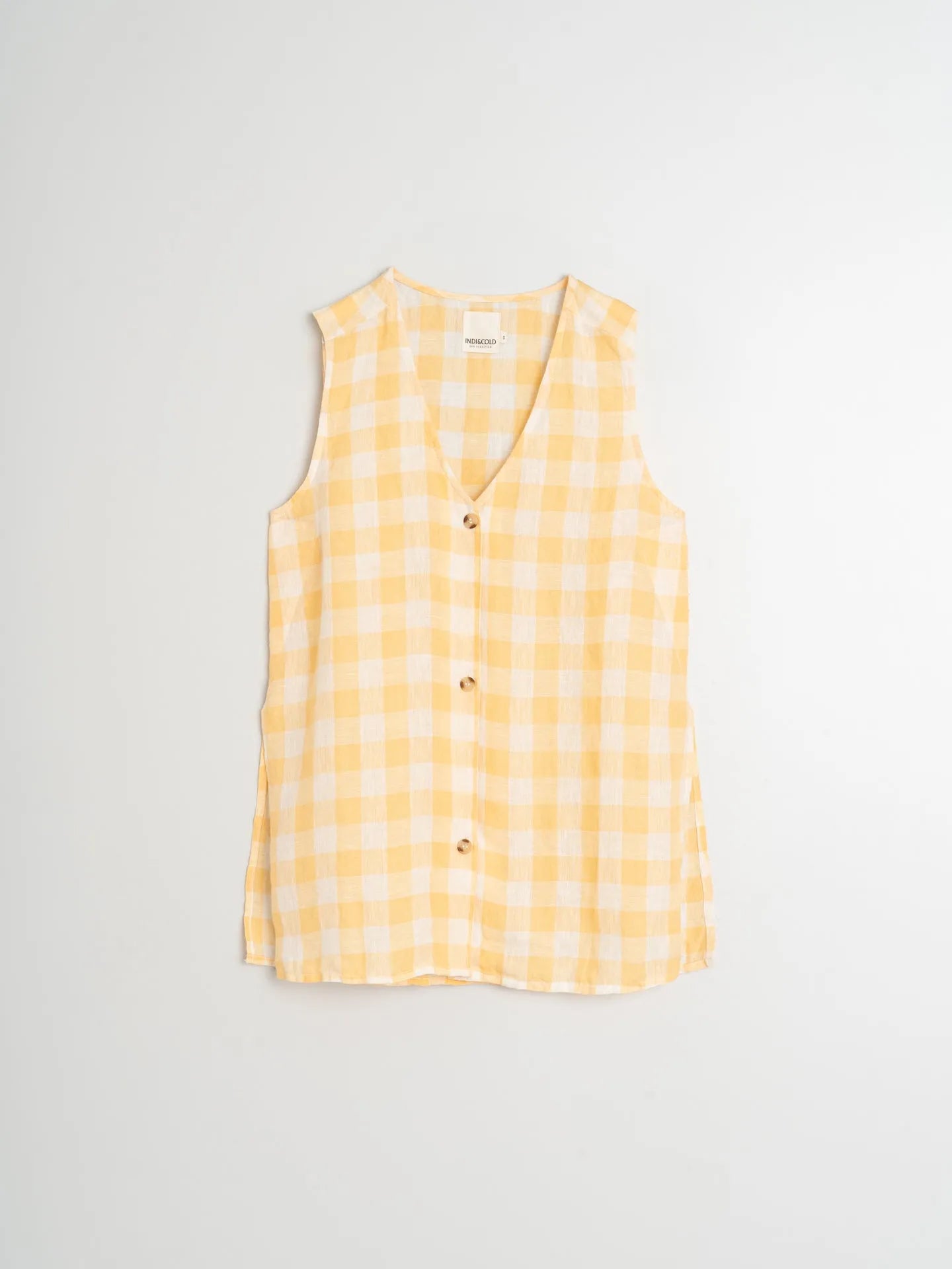 Yellow checkered sleeveless shirt on a light gray background