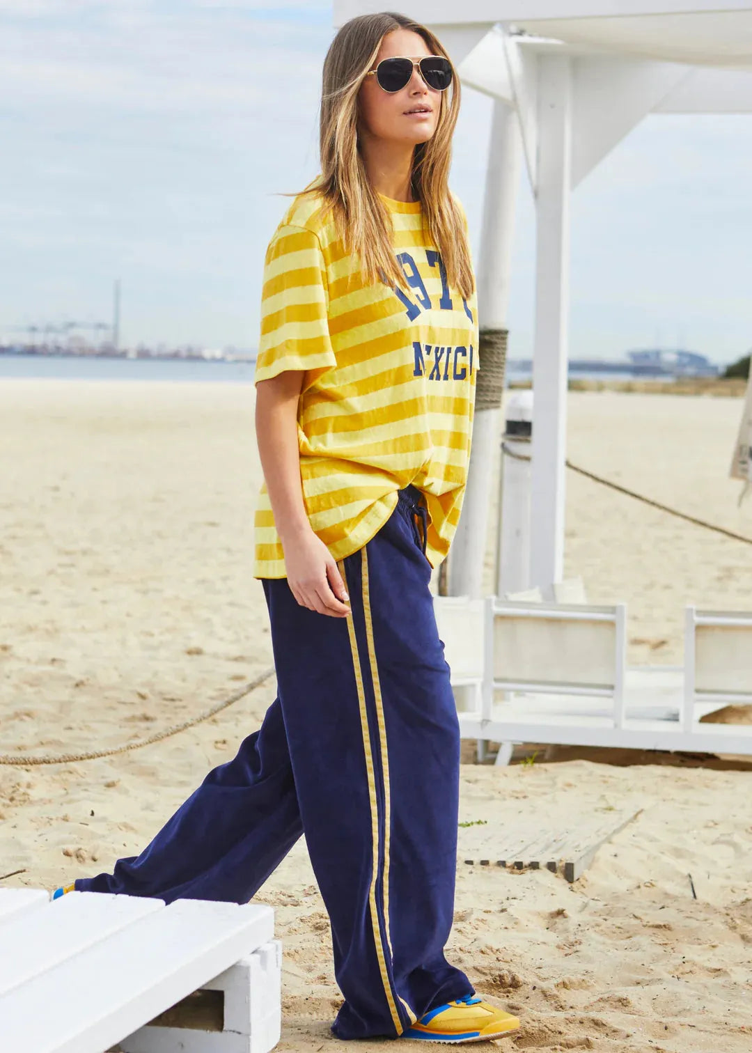 person wearing MEXICO 1976 STRIPE TEE - YELLOW STRIPE - Stay Wild Collective  