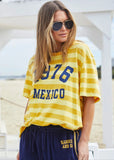 person wearing MEXICO 1976 STRIPE TEE - YELLOW STRIPE - Stay Wild Collective  