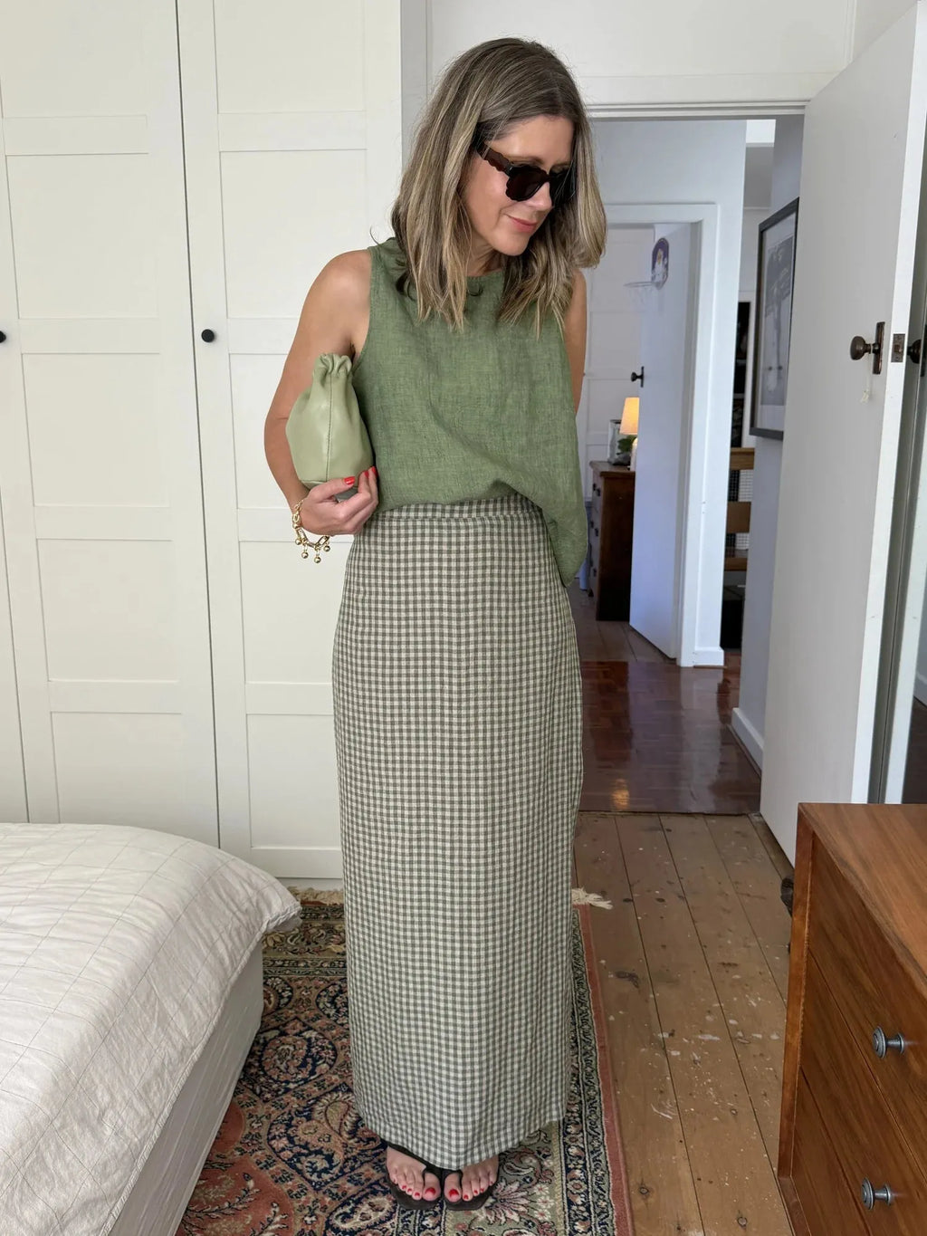 person wearing Montaigne French linen green check skirt - Stay Wild Collective  