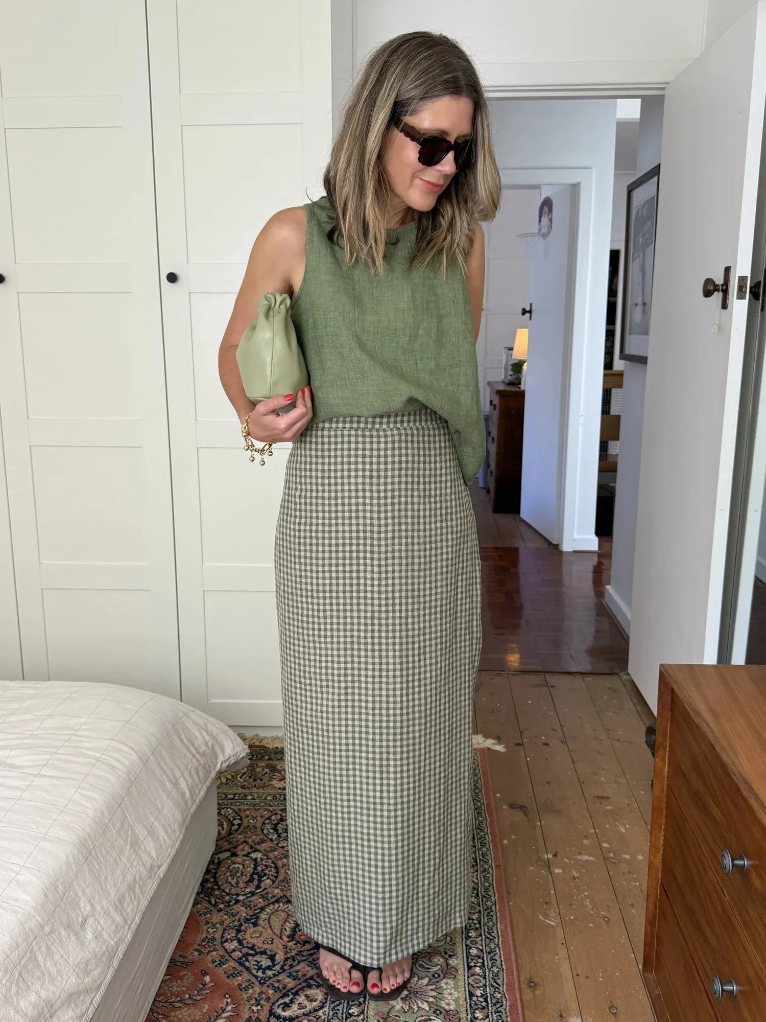 person wearing Montaigne French linen green check skirt - Stay Wild Collective  