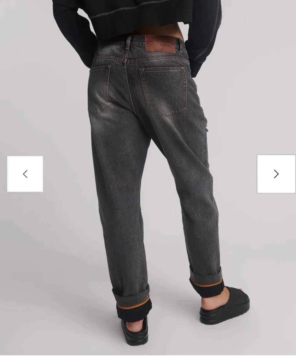 person wearing One teaspoon Bandits Low Waist Boyfriend Denim Jeans - Worn Black SALE - Stay Wild Collective  