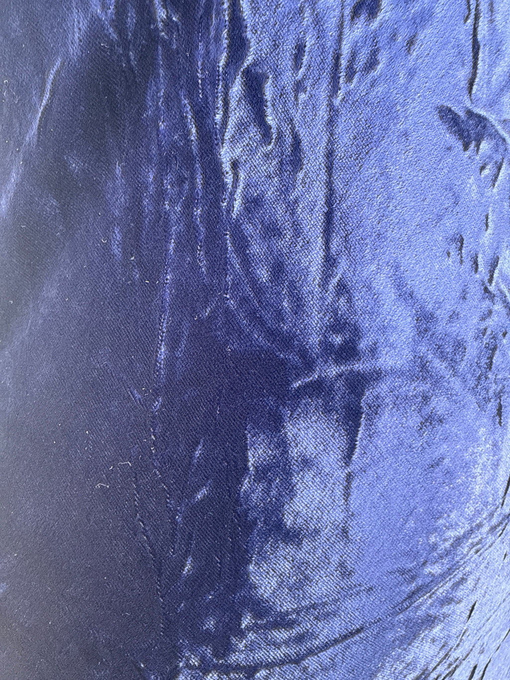 Close-up of blue fabric texture, velvet in the sunlight 