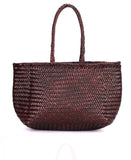 person wearing Rugged Hide Amalfi woven shopper - Stay Wild Collective  