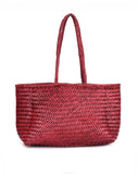 person wearing Rugged Hide Amalfi woven shopper - Stay Wild Collective  