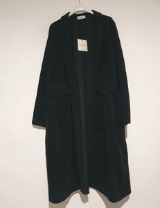 Woman wearing a frederic beige trench coat on a white background